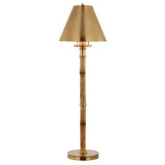 a gold floor lamp on a white background