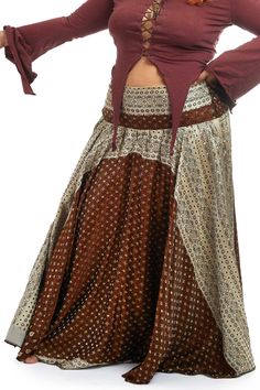 This long skirt is made from the beautiful silk fabric of a vintage sari. It is weighty and full, so has a beautiful sway when you walk or dance. Great for Tribal Fusion and Bellydance outfits. It has a smocked elastic waist at the back so will fit you perfectly. This is a one-off item, no other has been made made the same.   SIZE  Waist = 38-46" (96.5-117 cm) Length = 40" (101.5 cm) THIS LISTING IS FOR ALMOND Also available in a smaller size and many other colours, please have a look at our sho Bohemian Silk Long Skirt Bottoms, Bohemian Long Silk Skirt Bottoms, Bohemian Silk Long Skirt, Bohemian Full-length Skirt For Festivals, Bohemian Long Skirt For Festival, Full Length Bohemian Skirt For Festival, Bollywood Style Harem Pants For Festivals, Traditional Long Skirt With Boho Print, Bohemian Silk Wrap Skirt For Summer