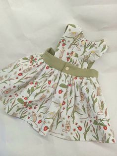 Isn't this print just the sweetest? This baby dress is a lovely old fashioned style pinafore-type dress made from a charming mouse-and-strawberries fabric. Great for everything from weddings to picnics to birthday parties, this dress is made from pretty, but sturdy and machine washable cotton for easy cleanup after the party is over!  Each dress is handmade in Michigan by sewist, farmer and mom-of-four, Liz. Cottagecore Sundress For Garden Party, Cute Sundress For Picnic, Cute Summer Dress With Bunny Print, Cotton Cottagecore Dress For Picnic, Cottagecore Cotton Dress For Picnic, Cute White Cotton Pinafore Dress, Cute Fitted Pinafore Dress For Spring, Cotton Cottagecore Pinafore Dress, Cute Cotton Pinafore Dress For Summer