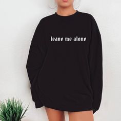 "Leave me alone Shirt, Anti Social Shirt, Goth Clothing, Grunge Sweatshirt, Gift For Her, Emo Shirt, Introvert Shirt Oversized sweatshirt Gifts Fall in love with this soft and cozy Unisex Graphic Tee or sweatshirt Please read TO MAKE YOUR SHOPPING EXPERIENCE EASIER, YOU CAN \"CHOOSE\" A T SHIRT, SWEATSHIRT OR HOODIE IN THIS LISTING. Available in Shirt, Sweatshirt and Hoodie Tee Shirt Shirt Sleeve Crewneck 100% Cotton Unisex Fit Sweatshirt and Hoodies Long Sleeve Soft 50/50 blend S-5X Unisex Fit Lazy Grunge Outfits, Grunge Sweatshirt, Emo Shirt, Clothing Grunge, Emo Shirts, Lounge Outfits, Slouchy Sweatshirt, Goth Clothing, Bohemian Tops