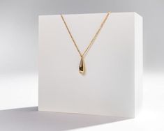 "INDRA" our minimalist water drop, teardrop gold pendant necklace. These lightweight gold necklace feature a simple style pendant with an abstract single water/teardrop droplet. These are made with 925 sterling silver throughout, coated with a layer of 18k gold, so easy to wear for an effortless everyday look! The necklace chain measures approximately 45.5CM in total (40.5 + 5CM extension).AS PICTURED: Taylor is stacking our INDRA teardrop necklace with our DAMLA droplet choker chain necklace.MA Adjustable Gold Teardrop Necklace, Gold Minimalist Necklace With Teardrop Pendant, Gold Minimalist Teardrop Pendant Necklace, Minimalist 14k Gold Teardrop Pendant Necklace, Minimalist Yellow Gold Teardrop Drop Necklace, Lightweight Gold Necklace, Tear Drop Pendant, Choker Chain, Stacked Necklaces