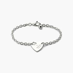 From the cut-out heart to the padlock charm, playful symbols continue to distinguish the jewelry for Pre-Fall 2024. This Gucci bracelet, crafted in sterling silver, features Gucci's trademark engraving on a heart pendant. Classic Heart Charm Bracelet In White Gold, Classic Sterling Silver Heart Charm Bracelet, Classic White Gold Charm Bracelet With Heart Charm, Classic White Gold Charm Bracelet With Heart, Sterling Silver Charm Bracelet With Heart Charm, Sterling Silver Charm Bracelet With Heart Charm For Everyday, Silver Personalized Heart Bracelet, Heart-shaped Sterling Silver Chain Bracelet In White Gold, Everyday Sterling Silver Charm Bracelet With Heart