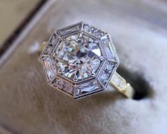 an antique diamond ring sits in a box