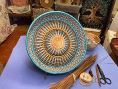 a table topped with lots of different types of baskets and other things on top of it