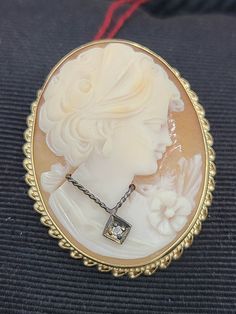 For Sale: (1) k840 Lovely Ladies Vintage 14kt Yellow Gold Carved Cameo Pin Pendant PLEASE READ ENTIRE DESCRIPTION BEFORE PURCHASING This is a lovely vintage carved cameo pin and pendant, set in 14kt yellow gold. This pretty lady features her wire necklace and diamond pendant.  Inside of bezel setting is stamped 14k. Would be a nice anniversary, birthday present, Christmas, Mother's Day or Valentine's Day gift for her! Specifics: 14kt Yellow Gold Cameo Pin Pendant Diamond weight: .01cts Weight: 7.4g/4.8dwt ---------------------------------------------------------------------------------- Please be 100% sure of your purchase before buying, as we do not offer refunds. We are more than happy to provide any specific pictures or answer any questions you have regarding our items. ALL INCLUDED ITE Pin Pendant, Wire Necklace, Valentines Day Gifts For Her, Birthday Presents, Diamond Pendant, Pretty Woman, Valentine Day Gifts, Yellow Gold, Gifts For Her