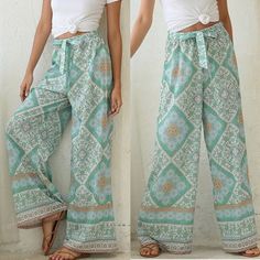 Floral Printing Wide Leg, Floor Length, Drawstring Waist. You Will Look Attractive To Wear It Just Pair With The Simplest Tee. Fabric 100% Polyester Pre-Order White Bohemian Cotton Harem Pants, White Bohemian Style Relaxed Fit Harem Pants, Casual Green Boho Print Bottoms, White Bohemian Harem Pants For Summer, White Hippie Bottoms For Summer, Spring Beach Harem Pants With Boho Print, White Bohemian Pants With Elastic Waistband, Bohemian White Pants With Elastic Waistband, White Bohemian Harem Pants For Vacation