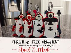 Add a touch of whimsy and charm to your holiday decor with these unique Card Soldier Laser Cut Christmas Tree Ornaments standing at 4.5 inches tall and 3.5 inches wide.  Inspired by the classic tale of Alice in Wonderland, these ornaments are meticulously crafted from plexiglass acrylic, ensuring durability and a beautiful finish. Each ornament features intricate laser-cut details that bring the card soldiers to life, making them a standout addition to any Christmas tree or wonderland themed wreath. Perfect for fans of Alice in Wonderland or anyone looking to add a unique twist to their holiday decorations, these ornaments also make wonderful gifts for friends and family. Whether you're decorating your own tree or looking for the perfect holiday gift, these card soldier ornaments are sure Alice In Wonderland Christmas Decor, Alice In Wonderland Ornaments, Alice In Wonderland Card Soldiers, Alice In Wonderland Christmas Tree, Card Soldiers, Laser Cut Christmas Tree, Unusual Christmas Ornaments, Alice In Wonderland Christmas, Playing Card Crafts