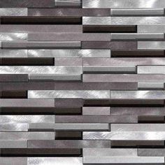 a close up view of a wall made out of silver and black tiles, with different colors