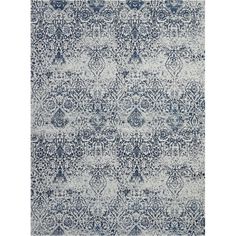 a blue and white rug with an intricate design