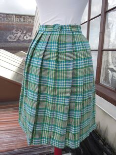 "Vintage 50's-60's perfect wool plaid pleated skirt. Main colors, are cream, teal and green. Great condition; no notable flaws. Hidden zip with button closure. Unlined. Waist:12.25\" across (24.5\" waist, a 25\" waist would be snug but it has a tiny bit of give) Length:21.25\" Hips:open (pleated)" Retro Green Pleated Skirt, Vintage Plaid Full Skirt, Vintage Pleated Plaid Skirt, Retro Plaid Full Skirt, Retro Full Plaid Skirt, Retro Full Skirt In Plaid, Pleated Short Skirt, Plaid Pleated Skirt, Belted Cardigan