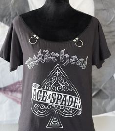 "Diy shirt Motörhead Lemmy Ace of spades top with shoulder off original concert shirt altered by Olivia Paige into women lace top Made from a original licence shirt SIZE medium 38-40\" chest you can also request custom top (band, lacing, size,..) just for you" Fitted Alternative Top For Concert, Fitted Alternative Top For Concerts, Fitted Alternative Style Top For Concerts, Stretch Tops With Graphic Print For Alternative Fashion, Stretch Graphic Print Top For Alternative Fashion, Stretch Grunge Festival Top, Grunge Stretch Tops For Concert, Stretch Grunge Top For Festival, Grunge Stretch Top For Festivals