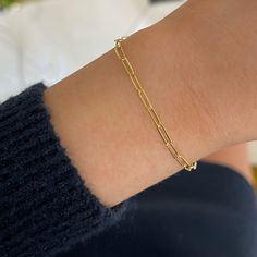 The Dani Paperclip Chain Bracelet is a best seller for a reason! This fun and contemporary design is perfect to add to your bracelet stack. Lightweight and easy to wear, you'll love to wear this bracelet year round. Metal: 14k Yellow Gold Chain Width: Approx. 2.5mm Length: 7 inches Closure: Lobster Clasp Looking for a different size? Please email us. Collar Chain, How To Make Rings, Band Bracelet, Bridal Bands, Choker Collar, Yellow Gold Chain, Womens Wedding Bands, Ring Fit, Fine Jewelry Collection