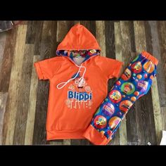 Let’s Get Blippi 3 Piece Set Unisex Can Be For Boys Or Girls This Set Comes With Graphic Hoodie Short Sleeve Shirt Matching Joggers Girls (Head Bow ) Boys (Shades ) This Set Is True To Size Playful Orange Tops For Playtime, Playful Orange Tops For Playwear, Casual Orange Tops For Playwear, Jogger Outfit, Baby Halloween Outfits, Sweats Outfit, Bird Costume, Light Pink Tops, Joggers Outfit