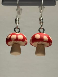 Elevate your style with these handmade clay mushroom earrings! Delightfully whimsical and lightweight, they add a touch of charm to any outfit. Perfect for nature lovers and those who appreciate unique accessories. Stand out with these playful earrings! Fun Mushroom Design Jewelry For Gifts, Fun Mushroom Design Jewelry Gift, Unique Adjustable Mushroom Earrings, Handmade Cute Mushroom Earrings, Cute Handmade Mushroom Earrings, Cute Mushroom-shaped Earrings For Gifts, Cute Handmade Mushroom-shaped Earrings, Whimsical Mushroom-shaped Earrings For Gifts, Whimsical White Mushroom Design Earrings