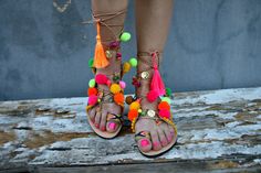 Multicolor tie up boho   leather sandals  embellished in pink ,yellow,green,orange pom poms and charms .Colourful and happy for all day long. Ideal for a perfect bohemian style. ♕ Designed to hold feet with minimal coverage and maximum stability ☀ Authentic Greek handmade ☆ Vegetable - tanned vachetta leather insole ☆ Anti-slip Italian SVIG sole ☆ Genuine leather straps ☆ Extremely flexible & lightweight - easy to walk ☆ An awesome Shoe-Box  All of our sandals are handmade in Greece in our works Bohemian Flat Lace-up Sandals For Beach, Bohemian Adjustable Flat Lace-up Sandals, Party Lace-up Open Toe Sandals For Beach Season, Summer Party Lace-up Open Toe Sandals, Summer Bohemian Flat Lace-up Sandals, Bohemian Flat Lace-up Sandals For Summer, Bohemian Flat Sandals For Summer, Bohemian Flat Lace-up Sandals With Adjustable Fit, Summer Vacation Toe Ring Sandals With Round Toe