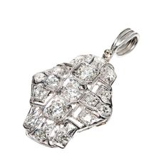 1940s handmade open work pendant set with European and transitional cut diamonds. Hinged handmade Platinum bail. 3 old European cut diamonds approximate total weight .60cts. 14 European cut diamonds approximate total weight .70cts, G-H, VS1-SI1. Tested: Platinum. 5.0 grams. 1 x ¾ inch without bail. Bail: 7/16 x 1/8 inch. Platinum Pendant, Antique Wedding Bands, Diamond Sapphire Engagement Ring, Blue Sapphire Pendant, Antique Engagement Rings Vintage, Antique Jewelry Necklace, Antique Bracelets, Vintage Sapphire, Diamond Engagement Rings Vintage