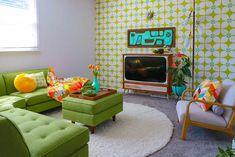 a living room filled with furniture and a flat screen tv