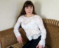 "Also you can find other Crochet blouses here: https://www.etsy.com/shop/NataliStudioUA?ref=seller-platform-mcnav&section_id=22291529 Hand made. Crochet white summer blouse. Crocheted blouse crocheted from beautiful and very delicate motifs. Motifs are connected to each other in the process of knitting according to the scheme. This interesting and openwork blouse model will be a great addition or even a highlight in the wardrobe. Blouse length - 56 cm/22\" size: M (height of model 165 - 170 Crocheted Blouse, Crochet Blouses, Crochet Lace Blouse, Crochet White, Blouse Lace, Sweater Cotton, Vegan Clothing, Blouse Models, Summer Blouse