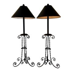 two lamps are sitting next to each other on a white background and one has a black shade