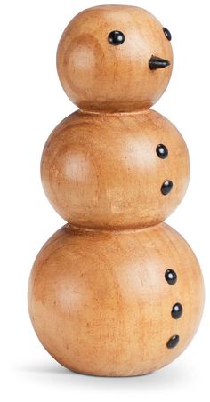 three wooden snowmen stacked on top of each other with black dots in the middle