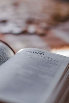 an open book sitting on top of a table