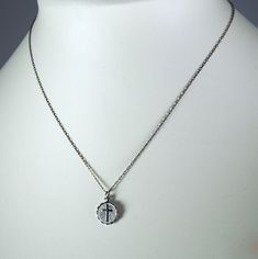 "This beautiful little vintage silver toned necklace hangs from a 16\" vintage chain. The Cross Charm is 1/2\" long and 1/2\" at the widest part. Dating back to the 60's, early 70s. Never before worn. If you would like a longer chain, please let me know, at no additional cost. This charm is also available for purchase in large quantities, without the chain as a charm. Please feel free to email me with any questions." Cross Charm Necklace, Vintage Chain, Charm Necklace Silver, Cross Charms, Religious Jewelry, Long Chain, The Cross, Necklace Silver, Miami Beach