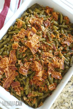 green beans with bacon in a white casserole dish