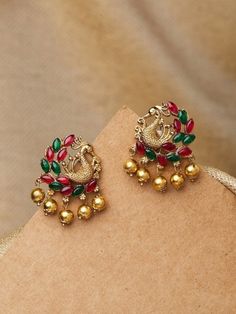 Gold and Green Peacock Shaped Earrings, gold-plated, and has artificial stones Secured with a post and back Size & Fit Length: 3.5 cm Material & Care Material: Alloy Stone Type: Artificial Stones Wipe with a clean cotton swab when needed Dispatch within 5 days Gold Jeweled Jhumkas As Gift, Jeweled Gold Jhumkas For Gift, Gold Jeweled Jhumkas For Gift, Gold Peacock Design Danglers As Gift, Gold Peacock Design Danglers For Gifts, Temple Jewelry With Peacock Design For Anniversary, Gold Peacock Design Danglers Gift, Gold Danglers With Peacock Design For Gift, Anniversary Temple Jewelry With Peacock Design