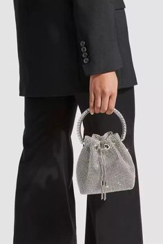 Love the Harlow Silver Crystal Embellished Bucket Bag for all occasions! This bag is made of PU material, and the surface is inlaid with hot diamonds. The chain allows you to straddle your body diagonally. The handle on the top makes it easy to carry it anywhere. This is a great accessory choice whether worn with dress Stretch Mesh Fabric, Embellished Bags, Rhinestone Clutch, Drawstring Bucket Bag, Rhinestone Decor, Bon Bon, Silver Crystal, Elegant Accessories, Mesh Bag