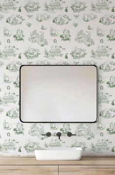 a bathroom vanity with a mirror and sink in front of a wallpapered background