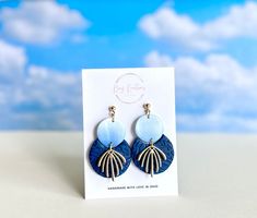 Featuring a stunning gradient of blue hues that create an elegant ombre effect, these handcrafted earrings are modern and classic at the same time. The textured navy combined with the gold accents add a cool touch of color to any outfit. Crafted from lightweight polymer clay and set on a hypoallergenic, nickel-free 4 mm gold ball post, these earrings make thoughtful gift for yourself or someone else. As with all handmade items, small imperfections, variations in color and size are possible. This Modern Blue Long Drop Earrings, Modern Blue Long Drop Jewelry, Modern Blue Teardrop Earrings, Blue And Gold Jewelry, Ombre Earrings, Jewelry Flower, Earrings Elegant, Handcrafted Earrings, Blue Ombre