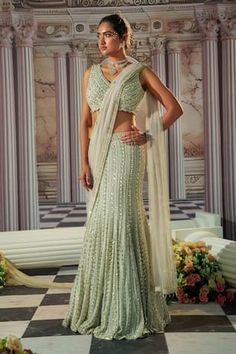 Grey mermaid cut lehenga with all over linear embroidery using sequins, crystals and beads. Paired with a coordinating blouse with scallop lace and dupatta with beaded border. - Aza Fashions Silver Lehenga, Grey Lehenga, Tuxedo Accessories, Georgette Lehenga, Gown Skirt, Indian Wedding Wear, Embellished Blouse, Sharara Set, Tailored Design