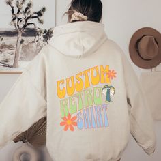 Show off your retro style with this Custom 3 Word Retro Font Oversized Hoodie. The vintage font is sure to make a statement and bring you back to the fun, classic days of the past. And the added Mushroom gives you a groovy vibe. With roomy, oversized fit, you'll be able to express yourself with comfort and ease. Ideal for any casual occasion, this Hoodie's retro look will take your wardrobe to the next level. This custom design Hoodie comes in your choice of 12 vibrant colors, perfect for making Retro Letter Print Hoodie Sweatshirt, Retro Oversized Hoodie For Streetwear, Large Retro Hoodie For Streetwear, Mushroom Hoodie Aesthetic, Groovy Font Sweatshirt, Mushroom Hoodie, Make Your Own Shirt, Groovy Font, Design Hoodie