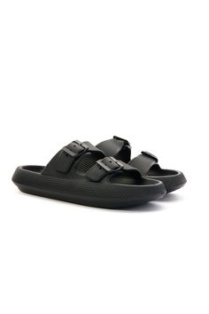 Discover the ultimate in comfort with Maibulun's Marshmallow Step Double Strap Sandals. These lightweight sandals feature a soft cushion and anti-slip sole for all-day wear. And with anti-odor material, your feet will stay fresh and comfortable. Perfect for any casual occasion. 0.98" Heel Slip-on / Buckle closure 100% pure thermoplastic upper 100% Thermoplastic Inner 100% Thermoplastic Sole Feature: Ultimate lightweight soft cushion. Anti-slip bulge sole™. Anti-odor tech material™. Black Slip-on Sandals With Adjustable Strap, Black Slip-on Synthetic Jelly Sandals, Synthetic Slide Flip Flops With Buckle Closure, Adjustable Buckle Closure Comfortable Flip Flops, Beach Slippers With Buckle Closure In Synthetic Material, Comfortable Adjustable Open Toe Jelly Sandals, Beach Slippers With Buckle Closure Slide, Beach Slippers With Buckle Closure, Beach Slide Slippers With Buckle Closure