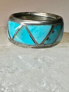 "Zuni ring Turquoise wedding band size 4.25  sterling silver women   Size  4.25 Between a size 4.25 and a size 4.50  Weight  6.2g  Width   3/8\" Free Shipping & Free/4 Postal Insurance  Delivered in a Gift Box  Free First Class shipping and postal insurance is included. If you want to upgrade to priority kindly pay an additional fee to do so.  This is recommended if you would like to have your package delivered faster than first class which has slowed down" Vintage Turquoise Promise Ring, Turquoise Vintage Promise Ring, Wedding Ring With Inlay Jewelry, Stamped 925 Turquoise Ring For Wedding, Vintage Silver Turquoise Ring For Wedding, Unique Stackable Turquoise Ring, Wedding Turquoise Ring Stamped 925, Silver Stackable Turquoise Ring For Anniversary, Turquoise Toe Ring Jewelry For Anniversary