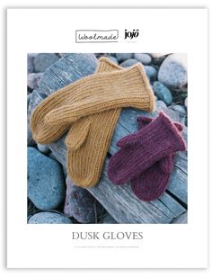 two knitted mittens and gloves sitting on top of rocks in front of the text,