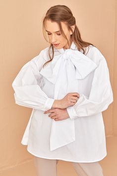 100% cotton houte couture shirt Shirt length: 80 cm Model height: 177 Long Sleeve Shirt With Bow For Spring, Chic Long Sleeve Shirt With Bow, Fall Puff Sleeve Blouse With Bow Detail, Fall Puff Sleeve Blouse With Bow, Chic Cotton Shirt With Tie Sleeves, Chic Tops With Detachable Bow For Spring, Cotton Puff Sleeve Top With Bow, Elegant White Shirt With Bow Detail, White Long Sleeve Blouse With Bow