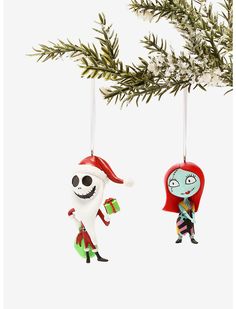 two ornaments hanging from a christmas tree