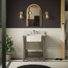 a bathroom with a sink and mirror next to a rug on the floor in front of it