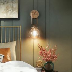 a bedroom scene with focus on the bed's headboard and bedside table lamp