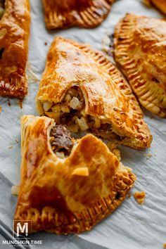 several pastries sitting on top of a piece of paper