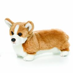 a brown and white stuffed dog standing next to each other