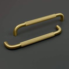 an antique brass door handle on a gray background