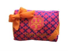 a pink and blue purse with an orange bow on the front that says, tony bark