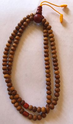 This small sandal wood mala has three traditional decoration beads and guru beads. It is from Nepal and nice and beautiful mala. it is 11 inches long mala. Holistic Healing Mala With Wooden Beads, Traditional Wooden Beaded Bracelets For Meditation, Holistic Wooden Beads Mala For Rituals, Holistic Wooden Mala For Rituals, Traditional Wooden Beads Necklace For Meditation, Traditional Wooden Bead Necklaces For Meditation, Natural Wooden Beads Spiritual Bracelet, Traditional Brown Mala For Meditation, Brown Bohemian Mala For Puja