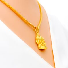 Introducing our Exclusive 22k Gold Shiv Parivar Pendant, a divine symbol of Lord Shiva and his family. This exquisite pendant is crafted from 22k gold, weighing 4.7 grams, and features intricate detailing. With a pendant length of 1 inch, it beautifully represents the essence of devotion. Please note that the chain is not included, allowing you to choose the perfect one to complement this sacred piece. PRODUCT DETAILS Gold Purity(karat): 22k Gold Weight(grams): 4.7 Item Finish: Yellow Gold Penda Shiv Parivar, Lord Shiva, 22k Gold, Shiva, 1 Inch, Essence, Yellow Gold, Chain, Pendant