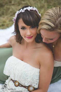 two beautiful women sitting next to each other