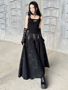 For a spring or autumn outfit with a dark, gothic flair, pair a black mid-length skirt featuring lace-up details with crosses. This ensemble offers an ultimate blend of edgy and elegant style. Garment Size SizeSMLWaist646872Full Length868788 Midi Skirt Spring, Steampunk Fashion Male, Gothic Skirts, Gothic Cross, Dark Fairy, Dark Gothic, Black Midi Skirt, Mid Length Skirts, Cut Out Design