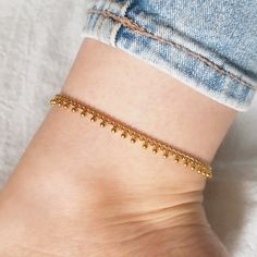 Gold woman anklet with dangling beads, made of stainless steel. 100% handmade ..:: Materials ::.. Stainless steel chain Stainless steel lobster clasp and extender chain ..:: Packaging ::.. Anklet comes on a cardboad card in transparent bag Each size comes with a 5cm (2 inch) extender chain for adjustment ..:: How to choose a right size ::.. Measure any other anklet you own. Or take a piece of string and put it around your ankle. Then measure the string.  Your measurement most likely will be some Gift Anklets With Tiny Beads, Gold Dangle Anklets As Gift, Gold Anklets With Tiny Beads As Gift, Gold Dangle Anklets For Gift, Gold Anklets With Satellite Chain As Gift, Gold Anklets With Satellite Chain, Gold Anklet With Satellite Chain For Gift, Gold Anklet With Chain Design For Gift, Gold Dangle Anklets With Adjustable Fit