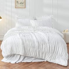 the comforter is white and has ruffled edges